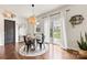 Cozy dining area with modern light fixture and access to the backyard through sliding glass doors at 10773 Sapphire Trl, Davidson, NC 28036