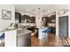 Modern kitchen with granite countertops, stainless steel appliances, and a center island with seating at 10773 Sapphire Trl, Davidson, NC 28036