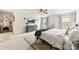 Serene main bedroom featuring neutral tones, a comfy bed, soft carpet, and sunlit windows with elegant curtains at 10773 Sapphire Trl, Davidson, NC 28036