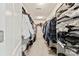 Well-organized walk-in closet features shelving and ample hanging space for clothes and accessories at 10773 Sapphire Trl, Davidson, NC 28036