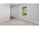 Neutral bedroom with a window and an entry door at 109 Landon Ct, Shelby, NC 28152