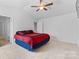 Relaxing bedroom featuring a ceiling fan, neutral walls, soft carpeting, and closet access at 109 Landon Ct, Shelby, NC 28152