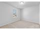 Bright bedroom with neutral walls, carpet flooring, and a large window offering plenty of natural light at 109 Landon Ct, Shelby, NC 28152