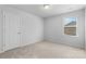 Inviting bedroom with neutral walls, soft carpeting, a window providing natural light, and closet space at 109 Landon Ct, Shelby, NC 28152
