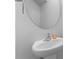 Cozy half bathroom featuring a white pedestal sink, oval mirror, and neutral wall color at 109 Landon Ct, Shelby, NC 28152
