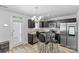 Modern kitchen with stainless steel appliances and a glass dining table for a contemporary touch at 109 Landon Ct, Shelby, NC 28152