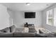 Inviting living room featuring a large sectional, TV, and plenty of natural light at 109 Landon Ct, Shelby, NC 28152