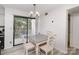 Bright dining area with white dining set and a large sliding glass door at 11063 Running Ridge Rd, Charlotte, NC 28226