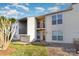 Charming townhouse with a balcony, neutral siding, and well-maintained lawn at 11063 Running Ridge Rd, Charlotte, NC 28226