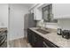 Modern kitchen features stainless steel appliances, granite counters, and sleek black cabinets at 11063 Running Ridge Rd, Charlotte, NC 28226