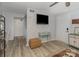 Cozy living room with wood-look flooring, stylish decor, and lots of natural light at 11063 Running Ridge Rd, Charlotte, NC 28226