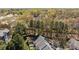Aerial view of townhomes surrounded by lush green trees at 11929 Kings Castle Ct, Charlotte, NC 28277