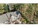 Aerial view of a lovely two-story townhome with mature trees and lush landscaping at 11929 Kings Castle Ct, Charlotte, NC 28277