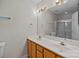 Bathroom vanity features dual sinks, a large mirror, and ample lighting at 11929 Kings Castle Ct, Charlotte, NC 28277