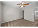 Bedroom with neutral walls, carpet, ceiling fan and attached bathroom at 11929 Kings Castle Ct, Charlotte, NC 28277