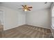Bedroom with neutral walls, carpet, a ceiling fan, closet and windows at 11929 Kings Castle Ct, Charlotte, NC 28277