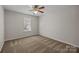 Bedroom with neutral walls, carpet, a ceiling fan, and a window providing natural light at 11929 Kings Castle Ct, Charlotte, NC 28277
