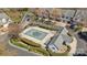 Aerial view of neighborhood pool showing the surrounding landscape and clubhouse at 11929 Kings Castle Ct, Charlotte, NC 28277