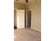 Bedroom showing open doorway, carpet, neutral paint and trim at 121 Irving Ave # A, Mooresville, NC 28117