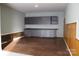 Two-car garage featuring built-in cabinets and updated lighting at 121 Irving Ave # A, Mooresville, NC 28117