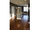 Spacious open kitchen featuring a kitchen island with pendant lighting and dark hardwood flooring at 121 Irving Ave # A, Mooresville, NC 28117