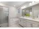 Spacious bathroom featuring a double vanity, soaking tub, and separate shower at 124 N Shayna Rd, Troutman, NC 28166