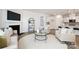Cozy living room flows into a kitchen with barstool seating, offering an open concept living space at 124 N Shayna Rd, Troutman, NC 28166