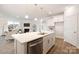 Open-concept home features kitchen island, dining area, and living room with fireplace at 124 N Shayna Rd, Troutman, NC 28166