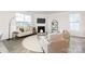Cozy living room features a fireplace, large windows, and neutral decor at 124 N Shayna Rd, Troutman, NC 28166