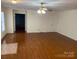 Spacious living room featuring hardwood floors and a ceiling fan at 139 Sain Rd, Statesville, NC 28625