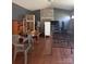 View of a cluttered living room featuring fireplace, door, and window at 143 Harvest Dr, Kings Mountain, NC 28086