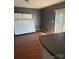 Living room featuring hard wood floors, grey walls, and a view of an island at 143 Harvest Dr, Kings Mountain, NC 28086
