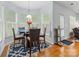 Bright breakfast nook with many windows, plantation shutters and a hardwood floor at 14923 Colonial Park Dr, Huntersville, NC 28078