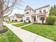 Traditional-style home with a neatly landscaped front yard, sidewalk and an inviting facade at 14923 Colonial Park Dr, Huntersville, NC 28078