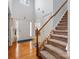 Bright foyer showcases hardwood floors, staircase, and a view into the living spaces at 14923 Colonial Park Dr, Huntersville, NC 28078