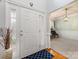 Open foyer featuring a stylish front door, hardwood floors, and a view into the adjacent dining area at 14923 Colonial Park Dr, Huntersville, NC 28078