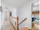Bright hallway with hardwood floors and natural light, leading to bedrooms at 14923 Colonial Park Dr, Huntersville, NC 28078