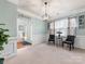 Formal living room featuring neutral colors, elegant lighting, and a view to the home's entry at 14923 Colonial Park Dr, Huntersville, NC 28078
