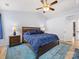 Comfortable bedroom features a ceiling fan, and natural light from the windows at 14923 Colonial Park Dr, Huntersville, NC 28078