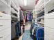 Spacious walk-in closet with custom shelving and ample storage space for clothing at 14923 Colonial Park Dr, Huntersville, NC 28078
