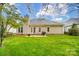 Backyard featuring a patio, grill and manicured lawn at 1509 Burning Lantern Ln, Kannapolis, NC 28081