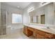 The bathroom is bright with a tub and shower and double sinks at 1509 Burning Lantern Ln, Kannapolis, NC 28081