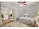 Cozy bedroom with a ceiling fan, bright natural light, and a relaxing atmosphere at 1509 Burning Lantern Ln, Kannapolis, NC 28081