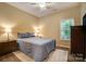 Inviting bedroom with a plush bed, side tables, and a view of the landscape at 1509 Burning Lantern Ln, Kannapolis, NC 28081