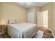 Bedroom with ceiling fan, double door closet, wood floor and natural light at 1509 Burning Lantern Ln, Kannapolis, NC 28081