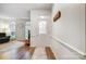 Elegant foyer with hardwood floors, decorative glass door, and access to the living area at 1509 Burning Lantern Ln, Kannapolis, NC 28081
