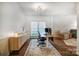 Bright home office with a large window, a modern desk, and stylish decor at 1509 Burning Lantern Ln, Kannapolis, NC 28081