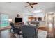 Spacious open-plan living area with hardwood floors and seamless transition to the kitchen at 1509 Burning Lantern Ln, Kannapolis, NC 28081