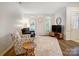 Cozy living room with comfortable seating, large windows, and stylish decor at 1509 Burning Lantern Ln, Kannapolis, NC 28081
