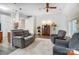 Contemporary living room featuring open floor plan, hardwood floors and direct kitchen access at 1509 Burning Lantern Ln, Kannapolis, NC 28081